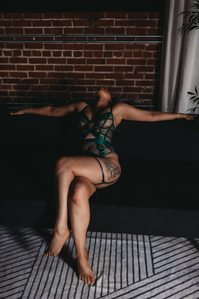 Artistic boudoir pictures of a woman in green lingerie during a professional boudoir photography session.
